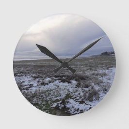 Sneeuw over de baai ronde klok