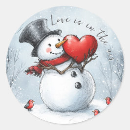 Sneeuwman geeft liefde met een groot hart ronde sticker