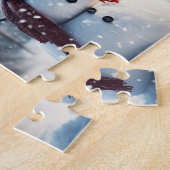 Sneeuwman in het dorp. Winterse tafereel. Legpuzzel (Zijkant)