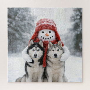 Sneeuwman knuffelt met Siberische Husky honden Legpuzzel