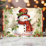 sneeuwman met Holly Merry Christmas Feestdagen Kaart<br><div class="desc">Deze charmante kerstkaart in stijl is voorzien van een feestelijke sneeuwpop versierd met een rode sjaal en heilige accenten. Het ontwerp van de waterverf wordt aangevuld met subtiele details en levendige hulstbladeren, waardoor het een perfecte keuze is voor het verspreiden van feestvreugde. Stuur je vrolijke kerstwensen met dit prachtig geïllustreerde...</div>