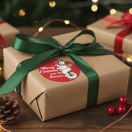 sneeuwman op eenwieler aangepaste kerst ronde sticker