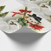 Sneeuwscène met vintage sneeuwman cadeaupapier (Hoek)