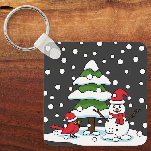 Sneeuwval op kardinaal-, neushoorn- en pijnbomen sleutelhanger (Voorkant)