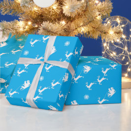Sneeuwvlok en kerstman met slee op blauw cadeaupapier