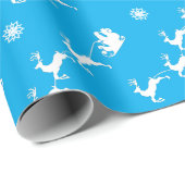 Sneeuwvlok en kerstman met slee op blauw cadeaupapier (Rol Hoek)