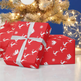 Sneeuwvlok en Kerstman met slee op rode Kerstmis Cadeaupapier