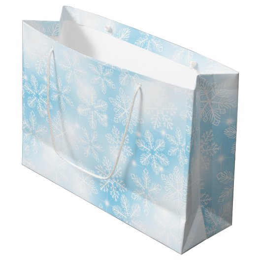 Sneeuwvlokken en lichten op blauw groot cadeauzakje (Voorkant Gekanteld)