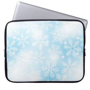 Sneeuwvlokken en lichten op blauw laptop sleeve