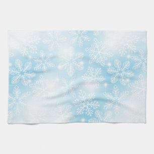 Sneeuwvlokken en lichten op blauw theedoek