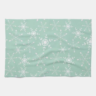Sneeuwvlokken met een achtergrond van de groene ke theedoek