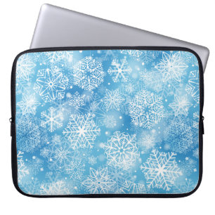 Sneeuwvlokken op blauw laptop sleeve