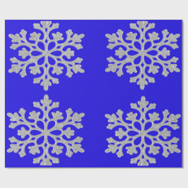 Sneeuwvlokken op blauw pakpapier