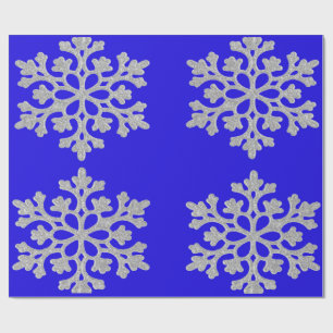 Sneeuwvlokken op blauw pakpapier