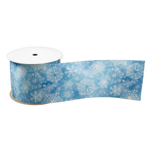 Sneeuwvlokken op blauw satijnen lint