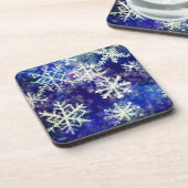 Sneeuwvlokken op blauwe drankkusten bier onderzetter (Linkerzijde)