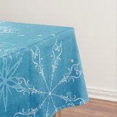 Sneeuwvlokken op blauwe tablet tafelkleed (Voorbeeld)