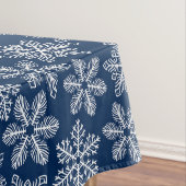 Sneeuwvlokken op donkerblauw tafelkleed (Voorbeeld)