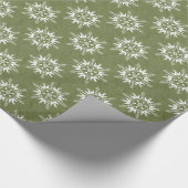 Sneeuwvlokken op groen cadeaupapier (Hoek)