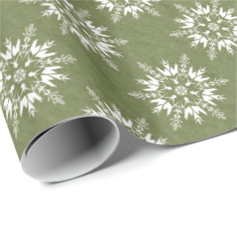 Sneeuwvlokken op groen cadeaupapier