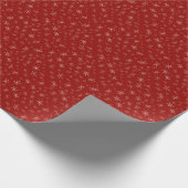 Sneeuwvlokken op rood cadeaupapier (Hoek)