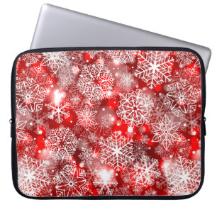 Sneeuwvlokken op rood laptop sleeve