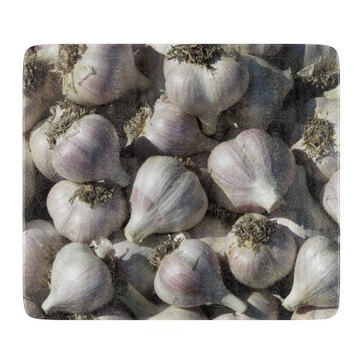 Snijplank van glas met oogst knoflook (Voorkant)