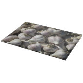 Snijplank van glas met oogst knoflook (Hoek)
