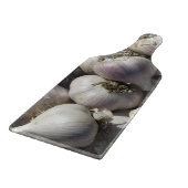 Snijplank van glas met oogst knoflook (Hoek)