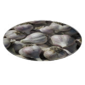 Snijplank van glas met oogst knoflook (Hoek)