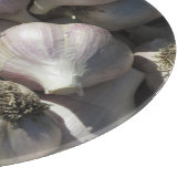 Snijplank van glas met oogst knoflook (Hoek)