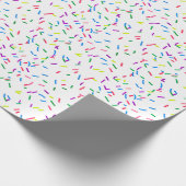 Snoepjes sprinken op wit omslagpapier cadeaupapier (Hoek)