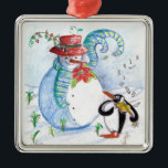 SNOWMAN EN PENGUIN WINTERSERENADE METALEN ORNAMENT<br><div class="desc">Whimsical,  kleurrijk origineel pastelschilderij in blauwe witte rode kleuren,  sneeuwman en pinguïn die in wintersneeuw viool spelen met rode bloemen,  bloedig.door Bulgan Lumini c.</div>