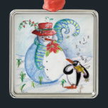 SNOWMAN EN PENGUIN WINTERSERENADE METALEN ORNAMENT<br><div class="desc">Whimsical,  kleurrijk origineel pastelschilderij in blauwe witte rode kleuren,  sneeuwman en pinguïn die in wintersneeuw viool spelen met rode bloemen,  bloedig.door Bulgan Lumini c.</div>