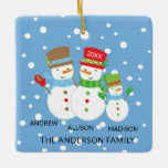 Snowman Family of 3 Christmas Ornament<br><div class="desc">Famy of 3 christmas ornament features a cute snowman koppel and on a snow filled blue background! Personalize with your information and date and you're all set to go! Wonderful dated keepsake gift for your first christmas and a great addition to you christmas ornament collection.</div>