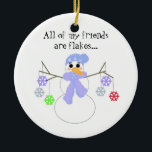 Snowman met Flakey Friends Keramisch Ornament<br><div class="desc">Een schattig ontwerp met een sneeuwman met twijgarmen met een hoop kleurrijke sneeuwvlokken.. zegt: "Al mijn vrienden zijn flakes... "</div>