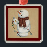 Snowman met licht versierend metalen ornament<br><div class="desc">Deze Snowman met lichtversiering is voorzien van een afdruk van een sneeuwpop die met behulp van acryl's met de hand schilderde. Een grote veetenstort!</div>