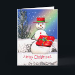 Snowman's kerstcadeautje feestdagen kaart<br><div class="desc">Een kerstwenskaart met mijn oorspronkelijke afbeelding van een glimlachende sneeuwman met een kerstcadeau op kerstdag.</div>