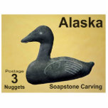 Soapstone Eider Duck - Alaska Postage Fotobeeldje Magneet<br><div class="desc">Een postzegel van een mythische onafhankelijke Alaska met een zeepijpsteen van een Eider Duck. De tekst, "Alaska, " "Postage 3 nuggets, " en "Spastone Carving" verschijnt ook. De Eider is de grootste eend die in Europa en Noord-Amerika wordt aangetroffen (met uitzondering van de Barbarijse eend die alleen in het zuiden...</div>