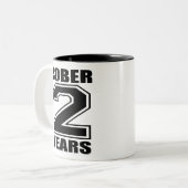 Sober 2 jaar zwart op wit tweekleurige koffiemok (Voorkant links)