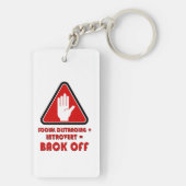 Sociale vervorming en introvert, uit sleutelhanger (achterkant)