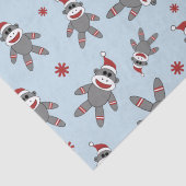 Socket Monkey met Santa Hat op Blauwe Kerstmis Tissuepapier (Detail)