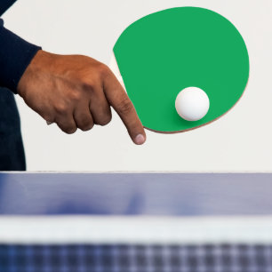 Solide groene achtergrond tafeltennisbatje