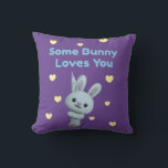 Some Bunny Loves You Kussen<br><div class="desc">Add warmth and charm to your home décor with the Some Bunny Loves You throw pillow! 🐰💜💛 Featuring a cheerful bunny surrounded by sweet yellow hearts and playful text, this design is perfect for spreading love and Easter joy. Ideal for couches, chairs, nurseries, or seasonal displays, it brings cozy comfort...</div>