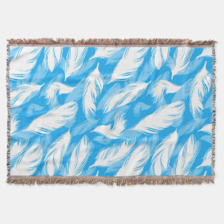 Sophisticated Feather Design On A Bright Blue Deken