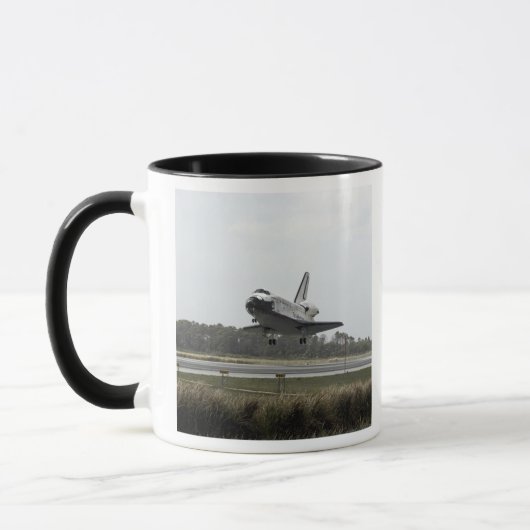 Space Shuttle Discovery-naderingen bij landing Mok (Links)
