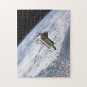Spaceshuttle STS115 Atlantis loskoppelen ISS 2006 Legpuzzel (Verticaal)
