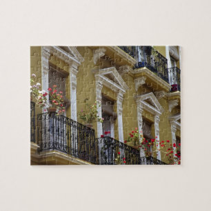 Spanje, Sevilla, Andalusië Geraniums hang over Legpuzzel