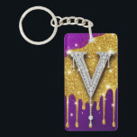 Sparkling Letter V With Gold Glitter Drip Sleutelhanger<br><div class="desc">Sparkling diamond-encrusted letter V set against a gold glitter field with dripping metallic effect and vivid purple background,  evoking luxury,  glam monogram style,  celebration and high-fashion bling.</div>
