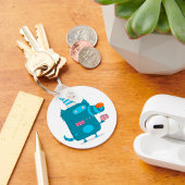 Speelse Blauwe Cartoon Monster met Feesthoed Sleutelhanger